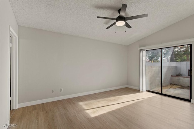 3936 Applecrest St, Las Vegas, NV 89108 - spare room featuring a textured ceiling, light wood finished floors, lofted ceiling, a ceiling fan, and baseboards