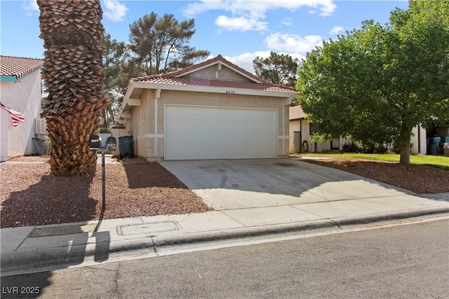 3936 Applecrest St, Las Vegas, NV 89108 - view of front of property featuring a tiled roof, stucco siding, concrete driveway, and a garage
