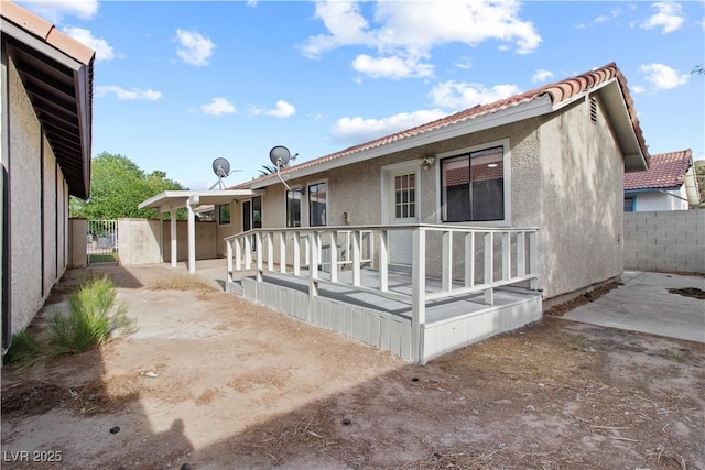 3936 Applecrest St, Las Vegas, NV 89108 - back of property featuring stucco siding, a gate, and a tiled roof
