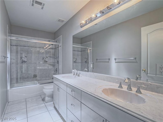 420 Dakar St, Henderson, NV 89015 - full bath featuring tile patterned flooring, shower / bath combination with glass door, toilet, and double vanity