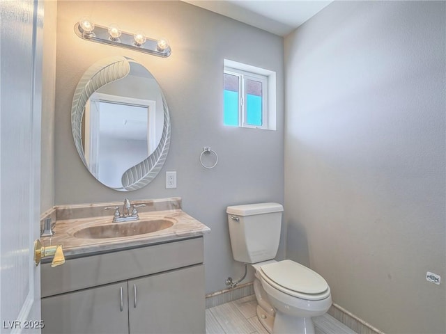 420 Dakar St, Henderson, NV 89015 - half bathroom with toilet, vanity, and baseboards
