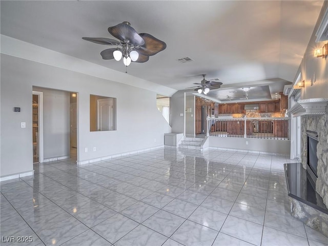 420 Dakar St, Henderson, NV 89015 - unfurnished living room with a ceiling fan, a fireplace, and baseboards