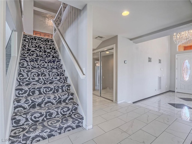 420 Dakar St, Henderson, NV 89015 - stairs with marble finish floors, a chandelier, baseboards, and recessed lighting