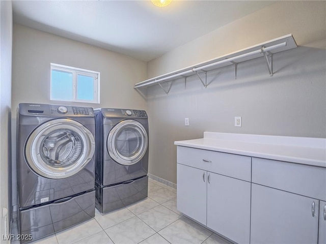 420 Dakar St, Henderson, NV 89015 - washroom featuring washing machine and clothes dryer, cabinet space, light tile patterned flooring, and baseboards
