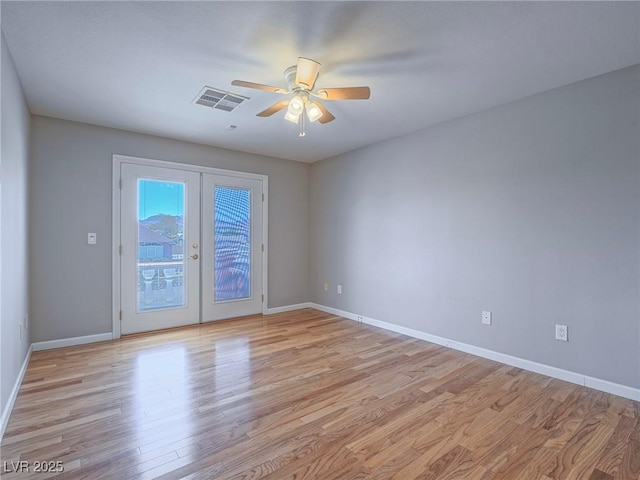 420 Dakar St, Henderson, NV 89015 - empty room featuring ceiling fan, light wood-style floors, french doors, and baseboards