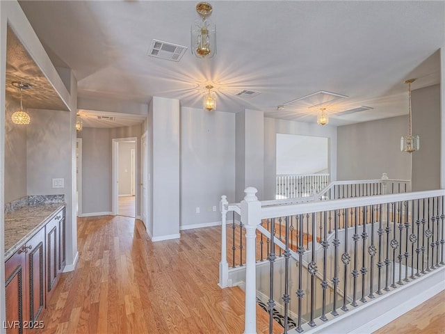420 Dakar St, Henderson, NV 89015 - hall with an upstairs landing, light wood-style flooring, and baseboards
