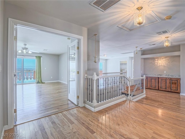 420 Dakar St, Henderson, NV 89015 - hallway featuring an upstairs landing, attic access, baseboards, and light wood-type flooring