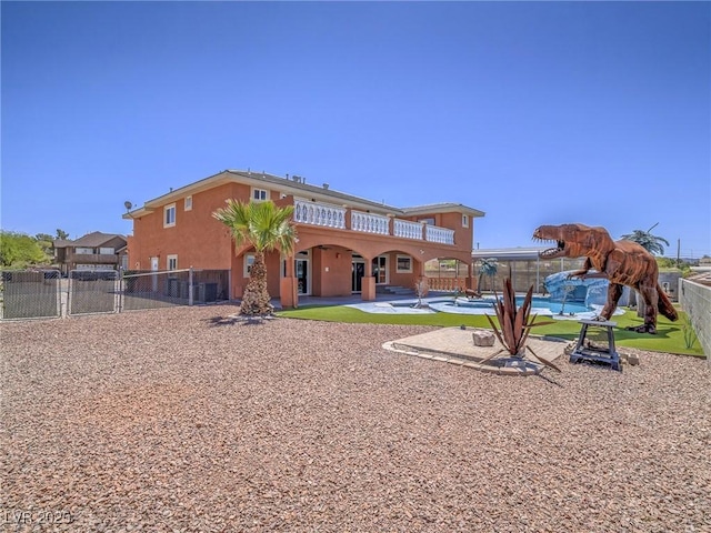 420 Dakar St, Henderson, NV 89015 - rear view of property featuring a pool, a fenced backyard, a patio area, stucco siding, and a gate
