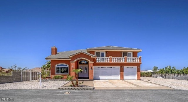 420 Dakar St, Henderson, NV 89015 - view of front of house featuring a chimney, driveway, an attached garage, a gate, and stucco siding