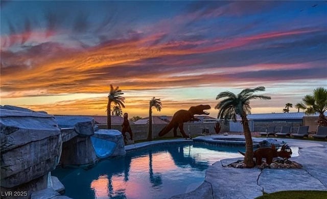 420 Dakar St, Henderson, NV 89015 - pool at dusk featuring a fenced backyard and a pool with connected hot tub
