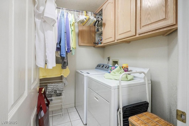 8236 Round Hills Cir, Las Vegas, NV 89113 - washroom featuring washer and clothes dryer, cabinet space, and light tile patterned floors