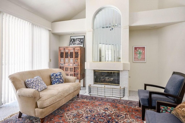 8236 Round Hills Cir, Las Vegas, NV 89113 - carpeted living room with a tile fireplace and lofted ceiling