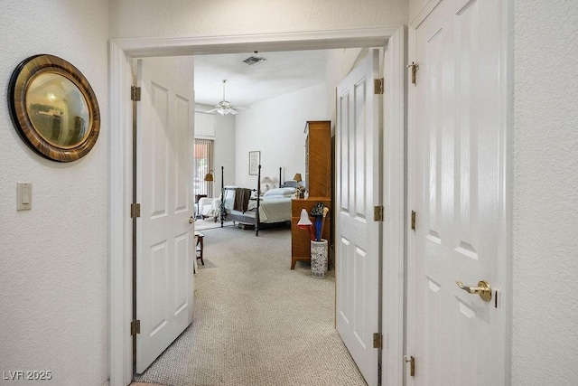 8236 Round Hills Cir, Las Vegas, NV 89113 - hallway with light colored carpet and a textured wall