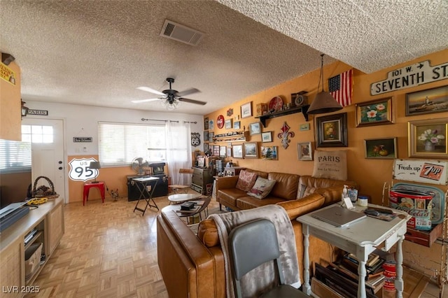 6432 Aberdeen Ln, Las Vegas, NV 89107 - living room featuring ceiling fan and a textured ceiling