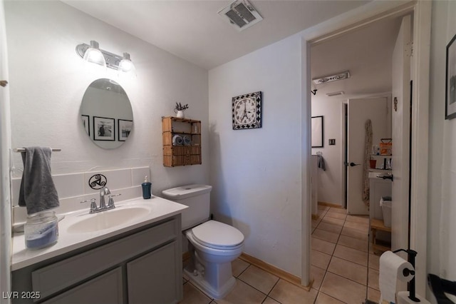 6432 Aberdeen Ln, Las Vegas, NV 89107 - half bathroom featuring tile patterned flooring, toilet, and vanity