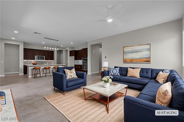 4829 E Beacon Ridge Dr, Pahrump, NV 89061 - living area with ceiling fan, recessed lighting, and baseboards