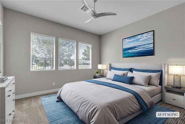 4829 E Beacon Ridge Dr, Pahrump, NV 89061 - bedroom with baseboards, light carpet, and a ceiling fan