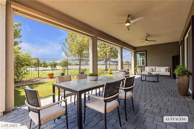 4829 E Beacon Ridge Dr, Pahrump, NV 89061 - sunroom featuring a ceiling fan, an outdoor living space, and outdoor dining area
