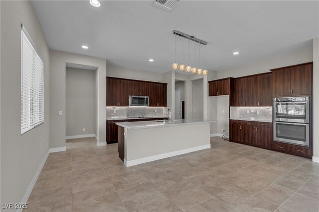 4829 E Beacon Ridge Dr, Pahrump, NV 89061 - kitchen featuring appliances with stainless steel finishes, decorative backsplash, light countertops, a sink, and recessed lighting