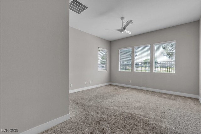 4829 E Beacon Ridge Dr, Pahrump, NV 89061 - spare room featuring baseboards, carpet floors, and ceiling fan