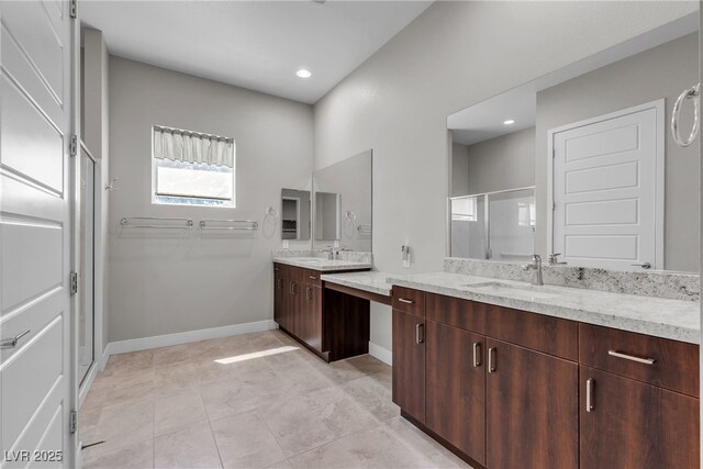 4829 E Beacon Ridge Dr, Pahrump, NV 89061 - bathroom featuring two vanities, a shower stall, baseboards, tile patterned flooring, and recessed lighting