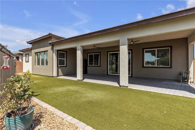 4829 E Beacon Ridge Dr, Pahrump, NV 89061 - back of house featuring stucco siding, a patio, and a ceiling fan