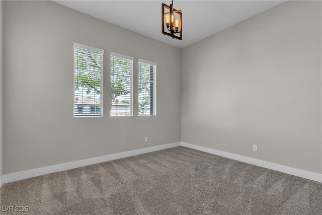 4829 E Beacon Ridge Dr, Pahrump, NV 89061 - spare room featuring a chandelier, carpet, and baseboards