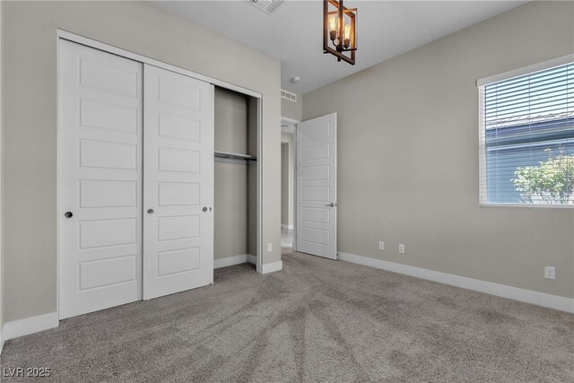 4829 E Beacon Ridge Dr, Pahrump, NV 89061 - unfurnished bedroom with a closet, carpet, a chandelier, and baseboards