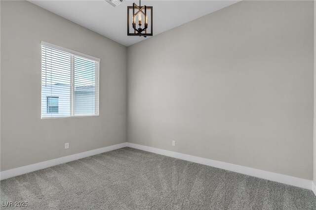 4829 E Beacon Ridge Dr, Pahrump, NV 89061 - carpeted empty room featuring a chandelier and baseboards