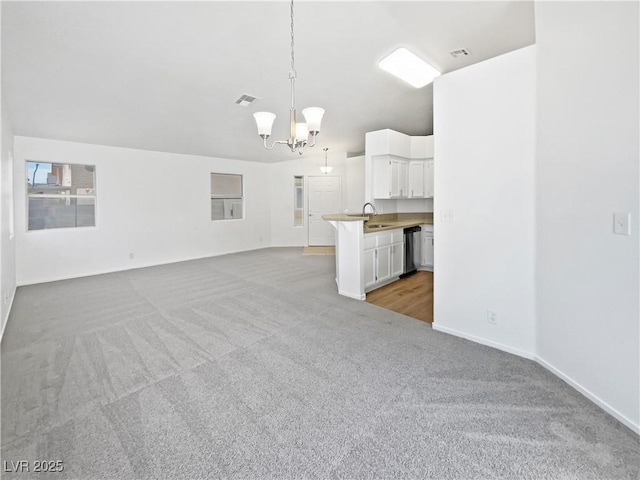 7524 Fencerow St, Las Vegas, NV 89131 - unfurnished living room with light carpet, a chandelier, baseboards, and a sink