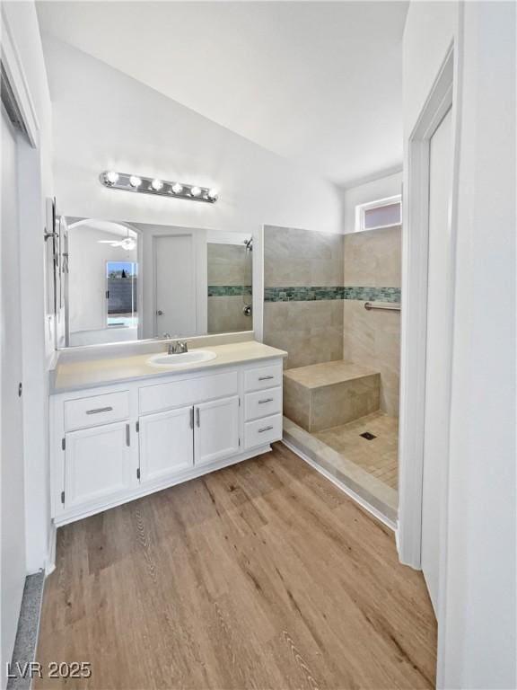 7524 Fencerow St, Las Vegas, NV 89131 - bathroom featuring a walk in shower, vanity, wood finished floors, and a ceiling fan