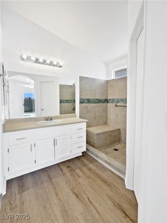 7524 Fencerow St, Las Vegas, NV 89131 - bathroom featuring a walk in shower, vanity, wood finished floors, and healthy amount of natural light