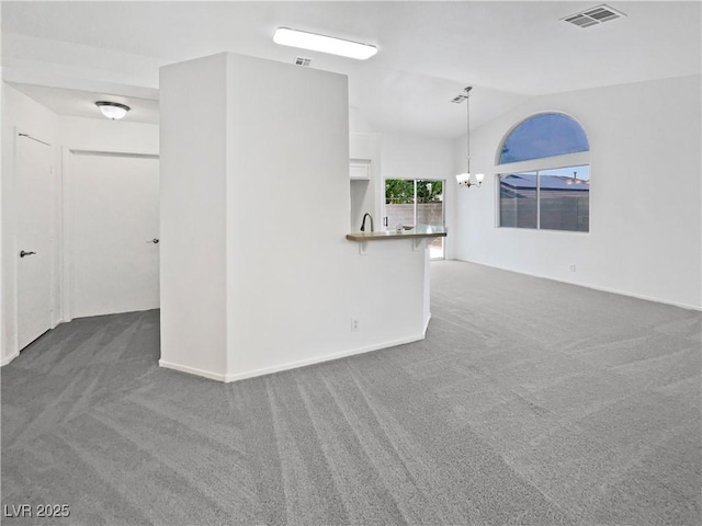 7524 Fencerow St, Las Vegas, NV 89131 - spare room featuring carpet floors, vaulted ceiling, a chandelier, and baseboards