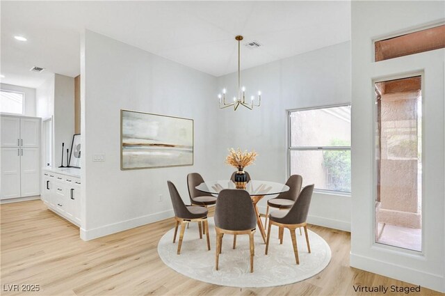 2353 Lauren Dr, Las Vegas, NV 89134 - dining room featuring light wood finished floors and a chandelier