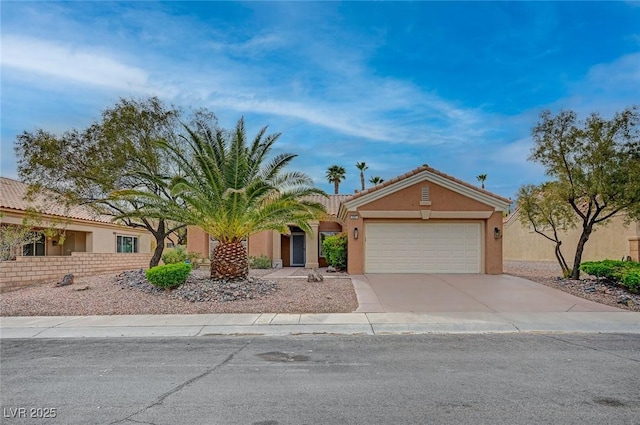 2353 Lauren Dr, Las Vegas, NV 89134 - view of front facade featuring an attached garage, stucco siding, concrete driveway, and a tile roof