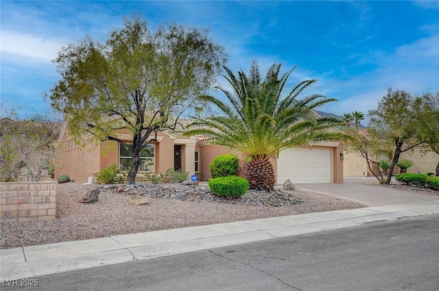 2353 Lauren Dr, Las Vegas, NV 89134 - view of front of house with stucco siding, a garage, and concrete driveway