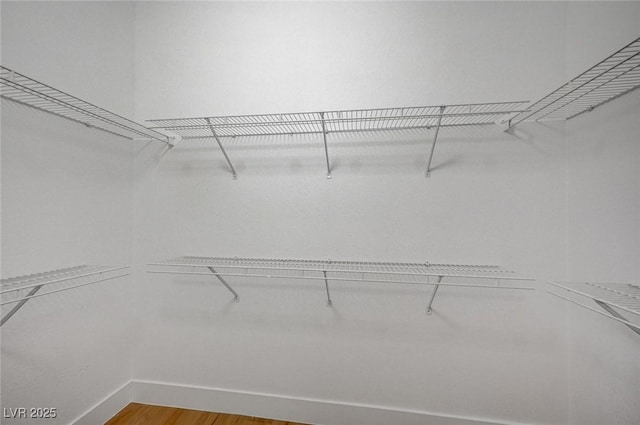 2353 Lauren Dr, Las Vegas, NV 89134 - walk in closet with light wood finished floors