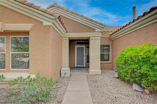 2353 Lauren Dr, Las Vegas, NV 89134 - entrance to property featuring stucco siding and a tiled roof