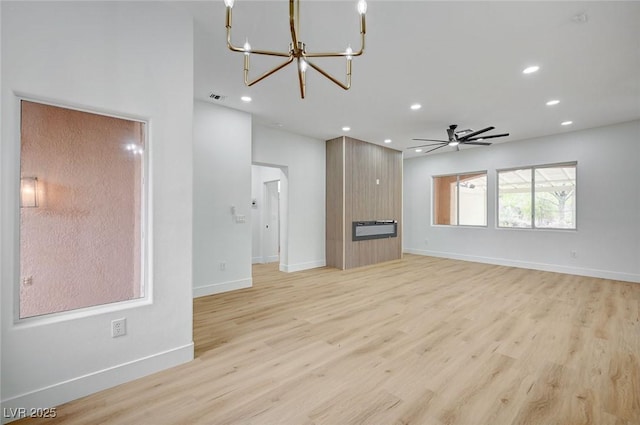 2353 Lauren Dr, Las Vegas, NV 89134 - unfurnished living room with a chandelier, light wood-type flooring, recessed lighting, and ceiling fan