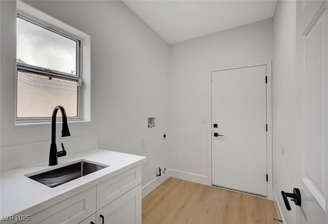 2353 Lauren Dr, Las Vegas, NV 89134 - laundry room with electric dryer hookup, light wood finished floors, washer hookup, and hookup for a gas dryer