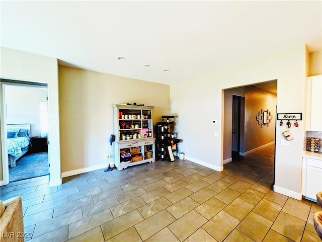 6021 Vivanco St, North Las Vegas, NV 89081 - dining area with baseboards and light tile patterned floors
