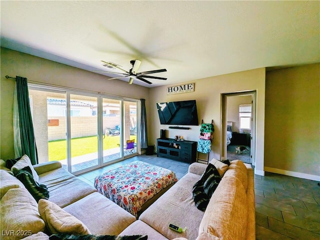 6021 Vivanco St, North Las Vegas, NV 89081 - living room with ceiling fan and baseboards