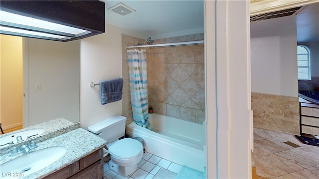 4998 Schumann Dr, Las Vegas, NV 89146 - bathroom featuring toilet, shower / bath combo, vanity, and tile patterned flooring