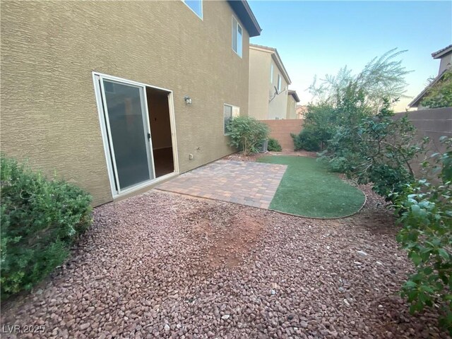 10537 Thor Mountain Ln, Las Vegas, NV 89166 - fenced backyard with a patio area