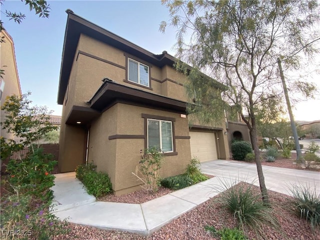 10537 Thor Mountain Ln, Las Vegas, NV 89166 - view of front facade featuring stucco siding and driveway
