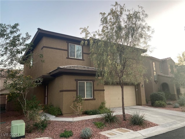 10537 Thor Mountain Ln, Las Vegas, NV 89166 - view of front facade with concrete driveway and stucco siding