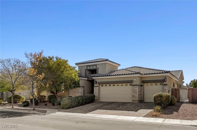 7331 Abundant Harvest Ave, Las Vegas, NV 89131 - view of front facade featuring stucco siding, an attached garage, a tiled roof, and stone siding