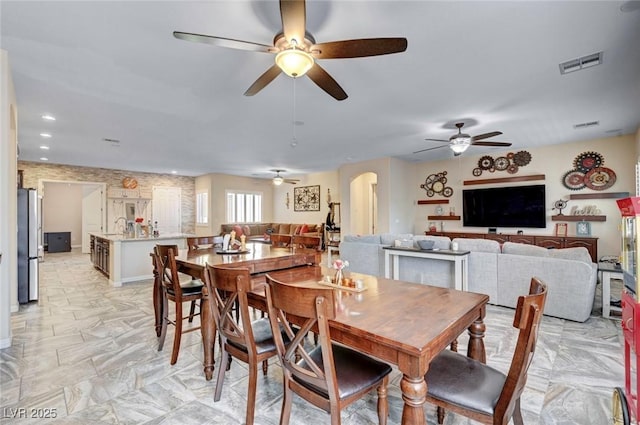 7331 Abundant Harvest Ave, Las Vegas, NV 89131 - dining area featuring ceiling fan and arched walkways