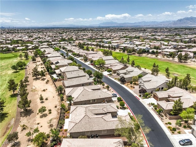 7332 Redhead Dr, North Las Vegas, NV 89084 - aerial view of residential area featuring a mountainous background and a golf course