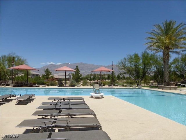 7332 Redhead Dr, North Las Vegas, NV 89084 - community pool featuring a mountain view and a patio area